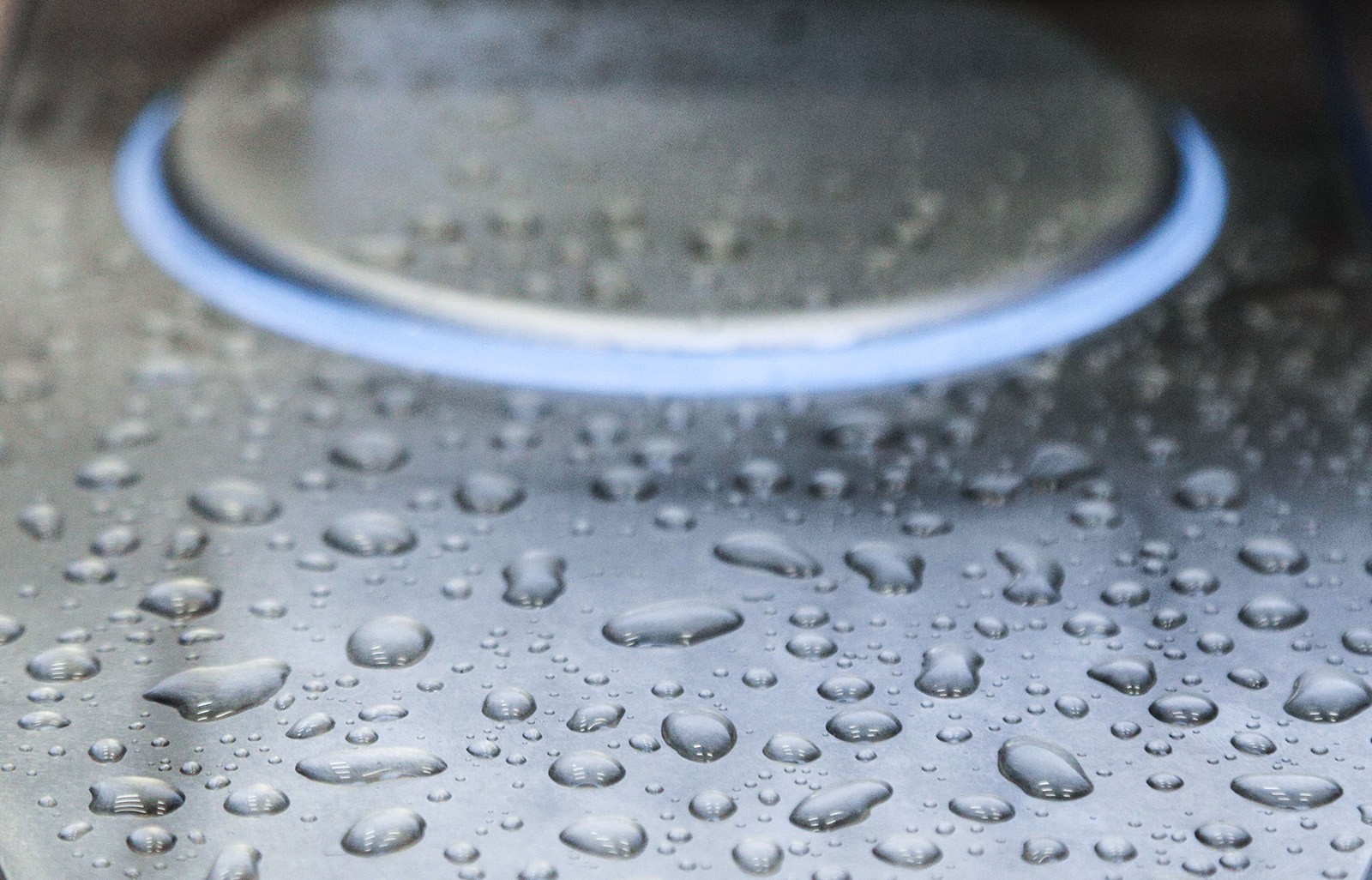 A render of three white cylindrical columns, against a warm creme background
