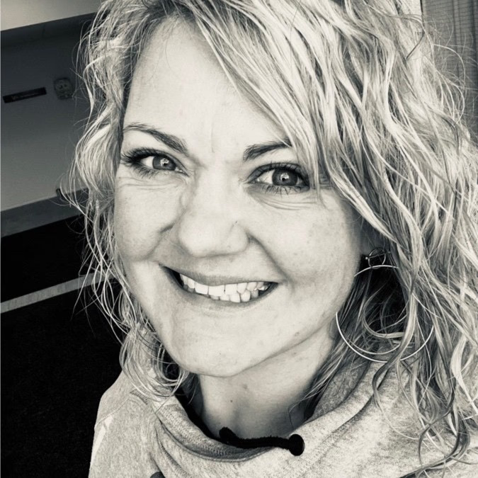 A render of three white cylindrical columns, against a warm creme background
